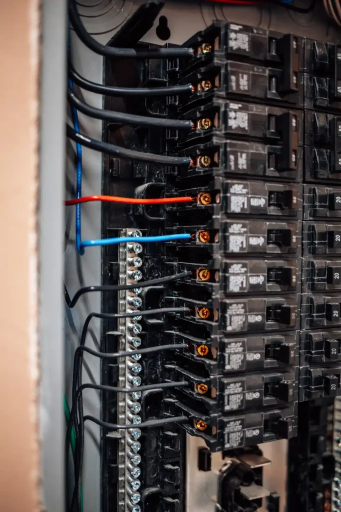 Close-up of electrical circuit breakers and wires.