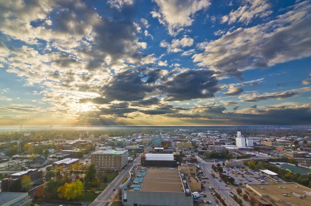 Aerial view of a city skyline at sunset.